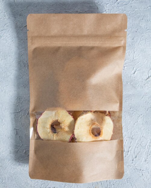 Photo dried apple in paper package