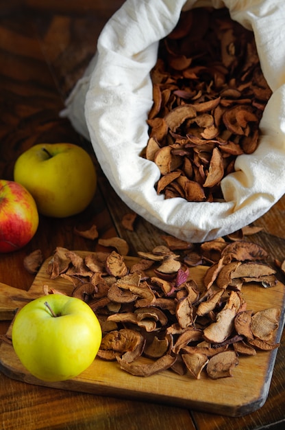 Dried apples on wooden table