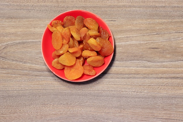 Dried apricot fruits on a saucer