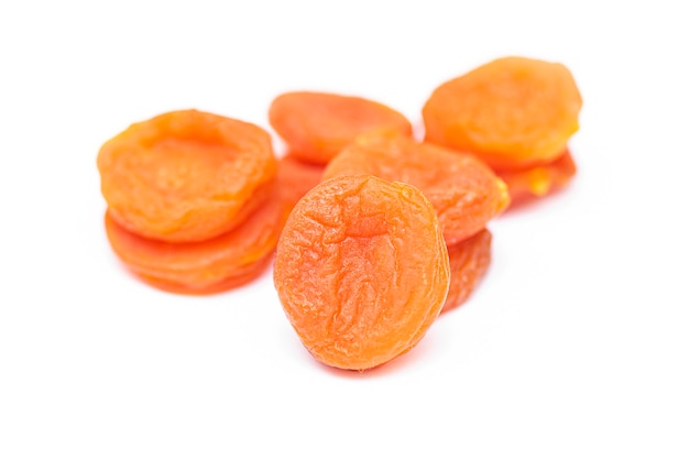 Dried apricots isolated on white, top view