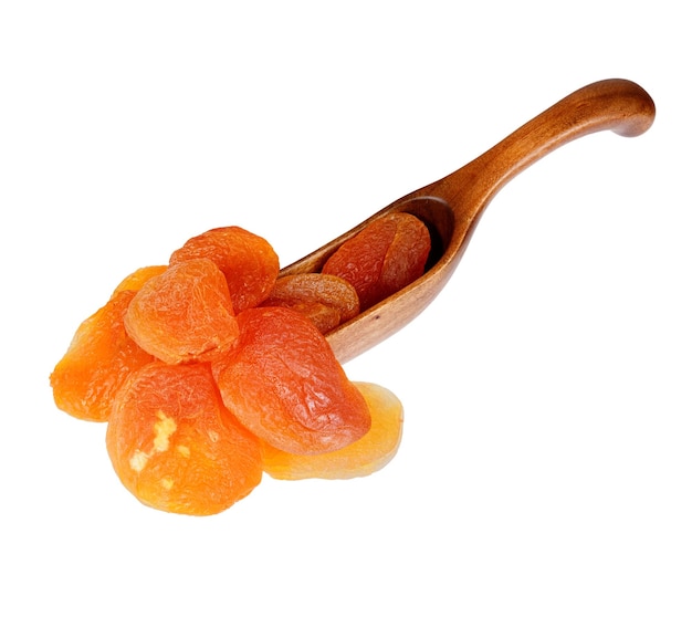 Dried apricots in the wooden spoon isolated on white background