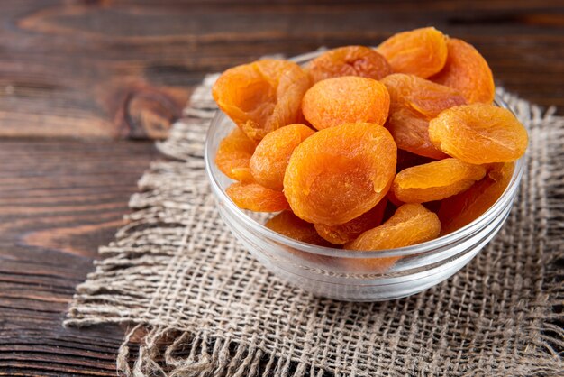 Dried apricots on a wooden table