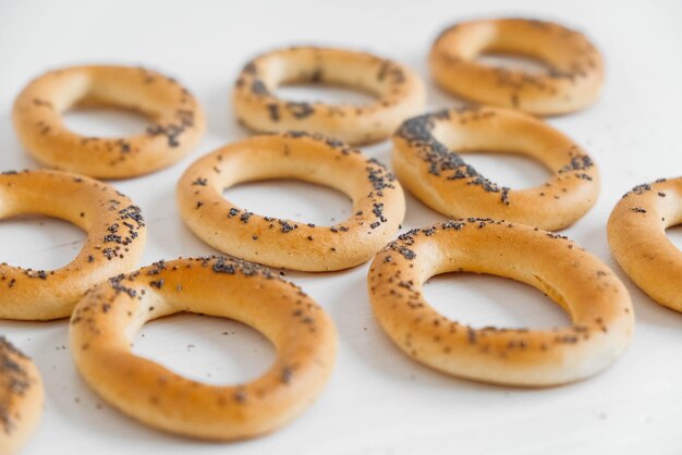 Dried bagels with poppy seeds on a white background