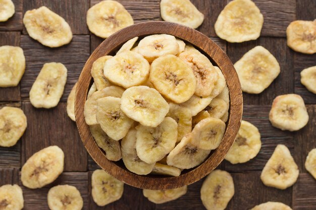 Dried bananas on wooden bowls