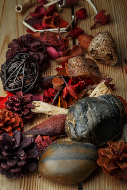 Dried bark and aroma flowers on a wooden table