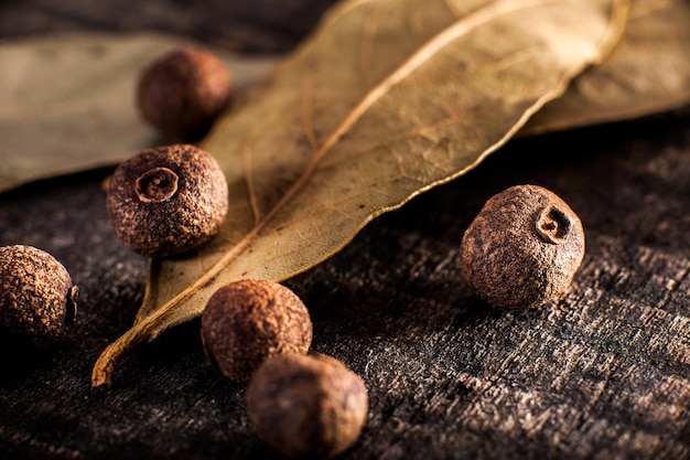 Dried bay leaf and large black peppercorns