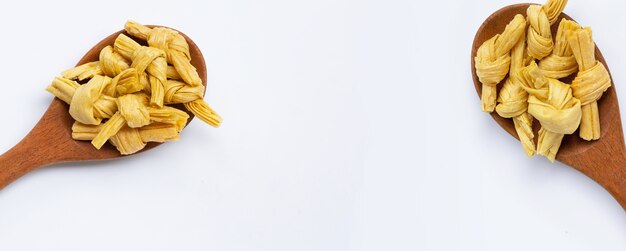 Photo dried bean curd knot on white background