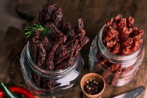 Dried beef and pork meat slices with spices and herbs