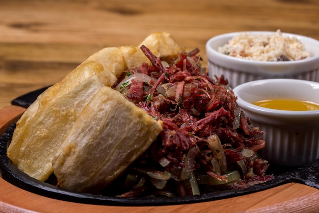 Dried beef with cassava traditional Brazilian food Close up