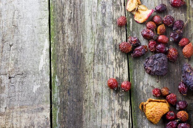 Dried berries on an old wooden surface