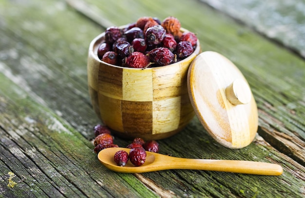 Dried berries in a wooden pot on the table