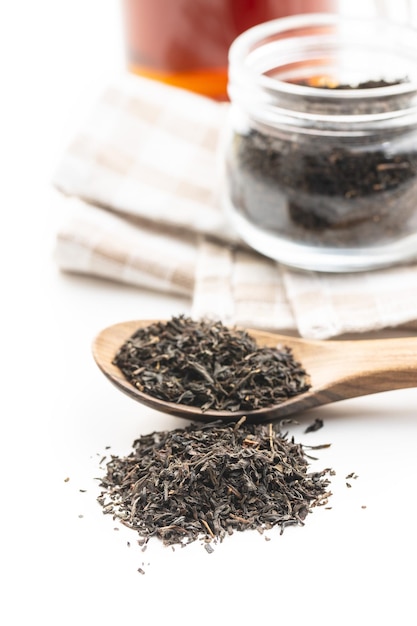 Dried black tea leaves isolated on white background