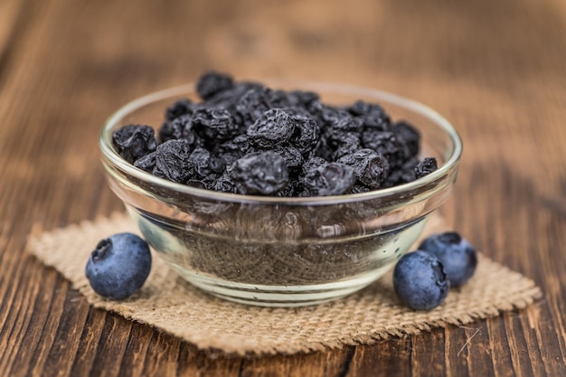 Dried Blueberries on wooden background selective focus