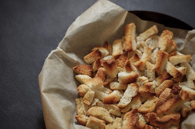 Dried bread rusk baked cooked in bulk on craft paper selective focus