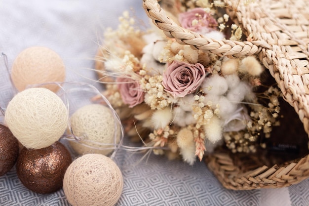 Dried bridal bouquet with decor on a plaid