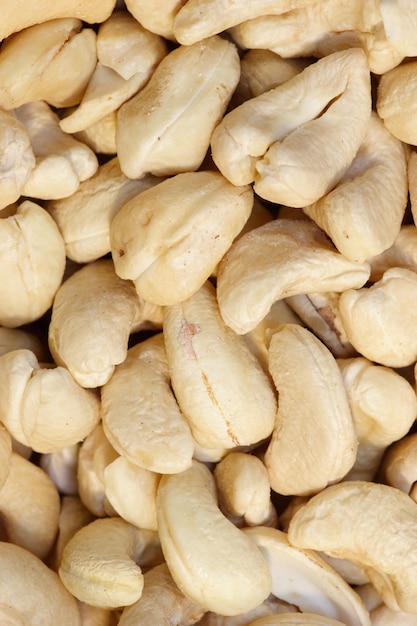 Dried cashew nuts closeup background