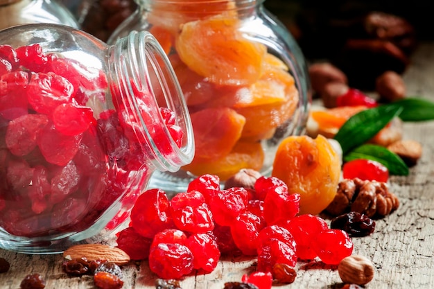 Dried cherries in a glass jar selective focus