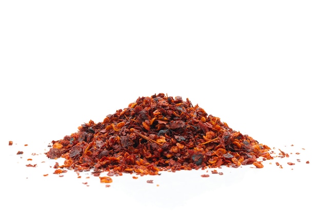 Dried chili meal on a white surface