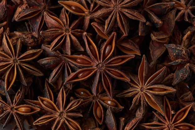 Photo dried chinese anise star spice background close up top view