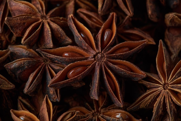 Dried chinese anise star spice background close up top view