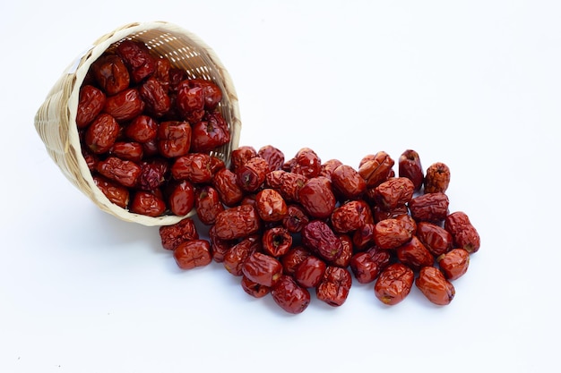 Dried Chinese jujubes on white background.