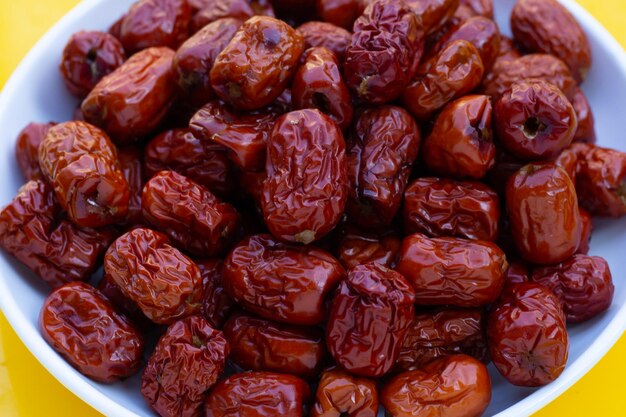 Dried chinese jujubes in white plate