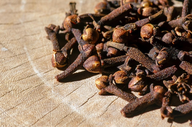 Dried cloves (Syzygium aromaticum)  on an old wood surface