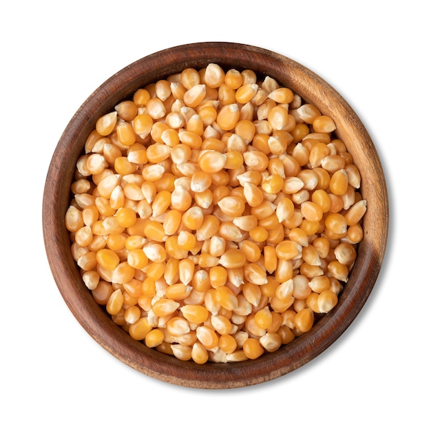 Dried corn or popcorn grains in a bowl isolated over white background.