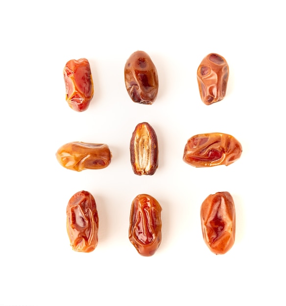 Dried dates isolated on white background. top view. flat lay.