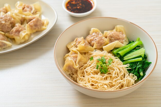 dried egg noodles with pork wonton or pork dumplings without soup Asian food style