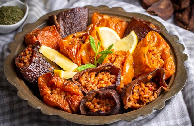 Dried eggplant stuffed and dried pepper stuffed with rice, tomato and olive oil known as dolma. (Turkish name; kuru biber dolmasi, kuru patlican dolmasi)