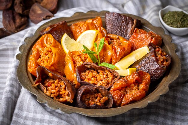 Dried eggplant stuffed and dried pepper stuffed with rice, tomato and olive oil known as dolma. (Turkish name; kuru biber dolmasi, kuru patlican dolmasi)