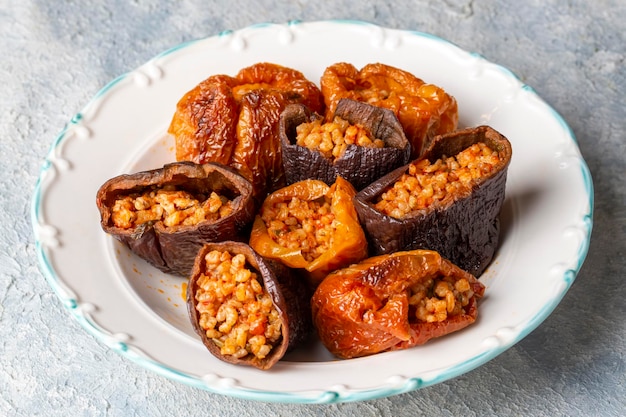 Dried eggplant stuffed and dried pepper stuffed with rice tomato and olive oil known as dolma Turkish name kuru biber dolmasi kuru patlican dolmasi