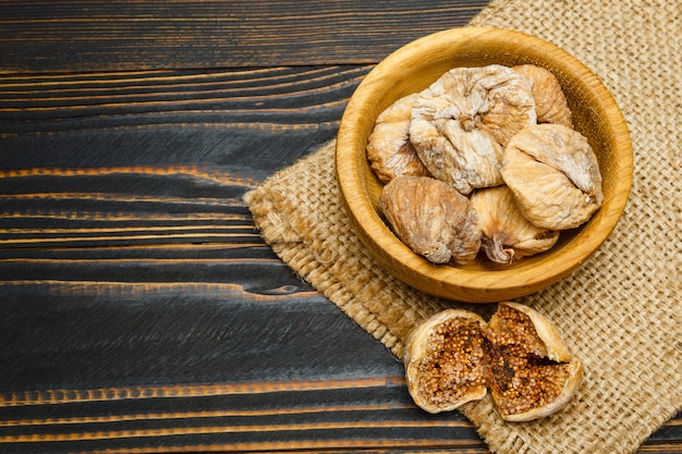 Dried figs on wooden table