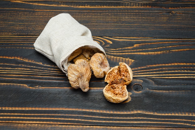 Dried figs on wooden table