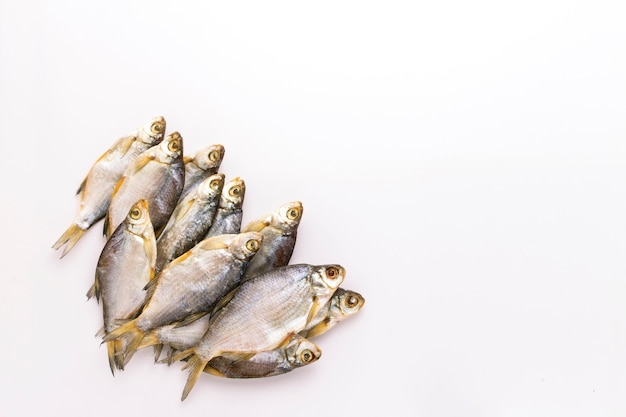 Dried fish on a white background. Flat lay, top view.