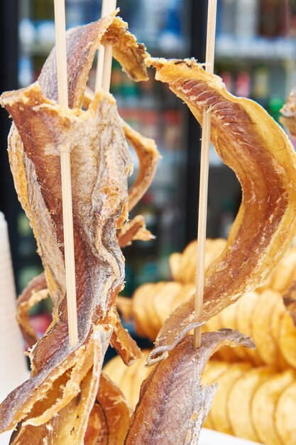 Dried fish on wooden stick