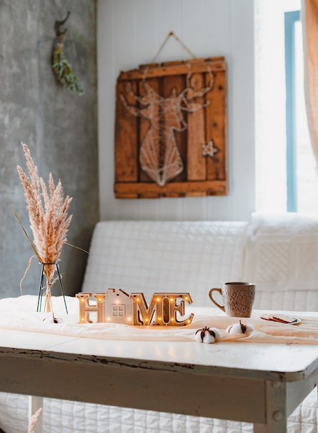 Dried flowers spikelets pampas vase-stand mug lamp white vintage table tablecloth knotted, home interior minimalist aesthetic.