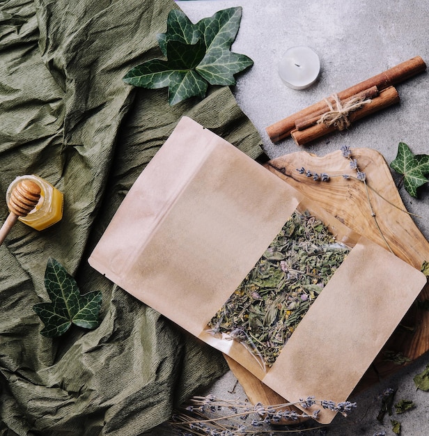 Dried and fresh tea leaves with tea honey and cinnamon