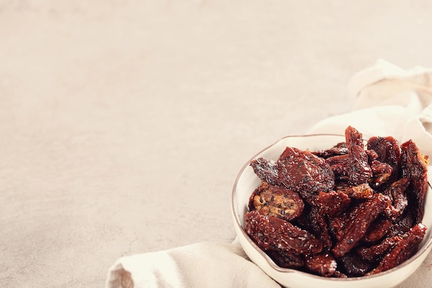 Dried and fried tomatoes in a bowl