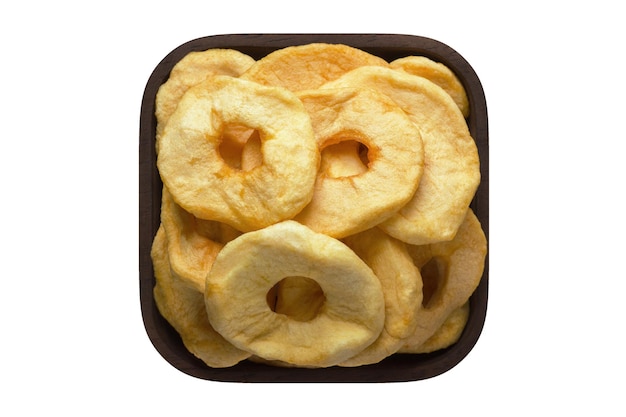 Dried fruit, apples rings in square bowl isolated on white background. organic food, top view.