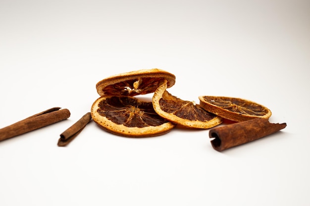 Dried fruit fruit and cinnamon on white background