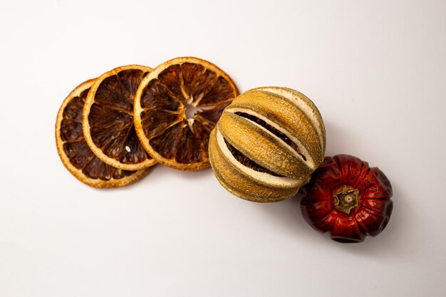 Dried fruit fruit and cinnamon on white background