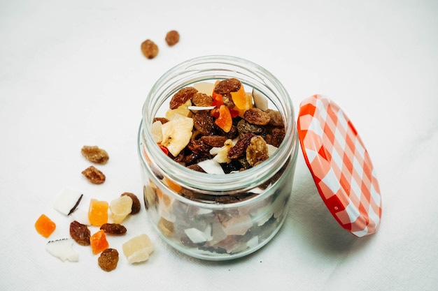 Dried fruit jar on white background