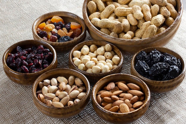 Dried fruit and various nuts on plates