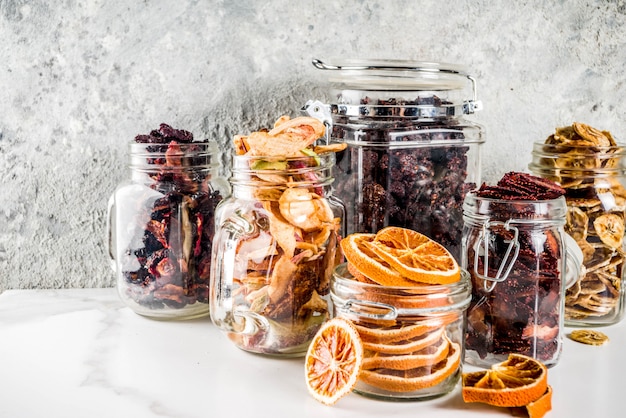 Dried fruits and berries in glass jars