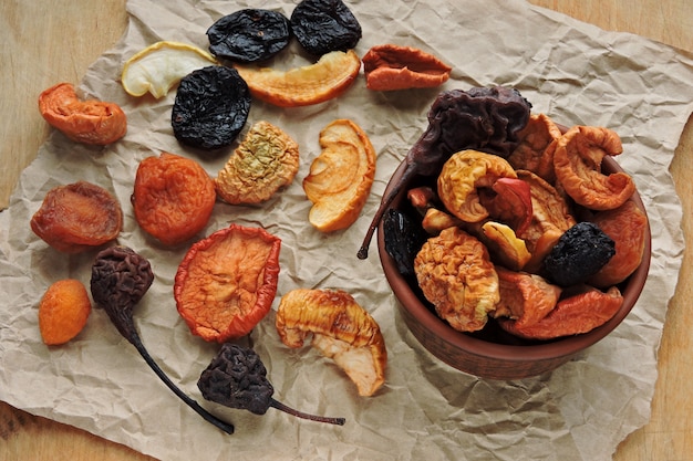 Dried fruits in a cup on paper. Top view.