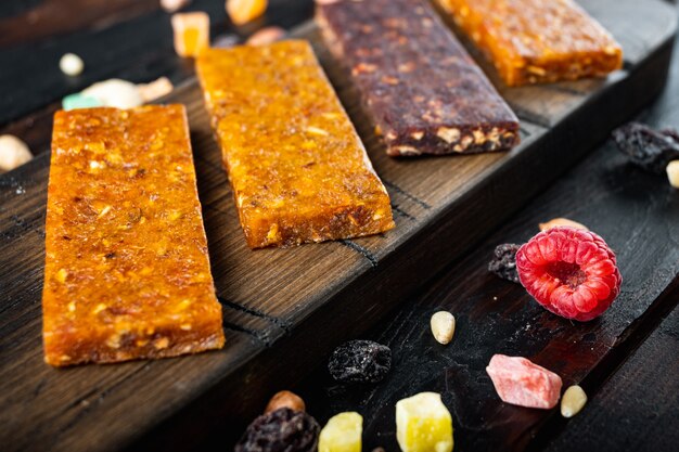 Dried fruits energy bars, on wooden table