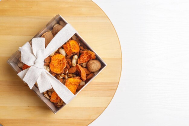 Photo dried fruits and nuts branch on white background concept of the jewish holiday tu bishvat copy space