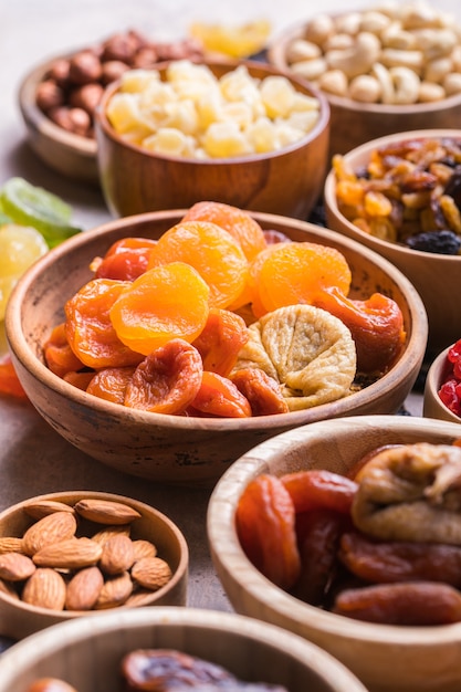 Dried fruits and nuts mix in a wooden bowl